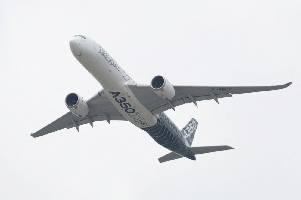 FILE PHOTO: A Airbus A350 aircraft during a display at the Farnborough International Airshow, in Farnborough