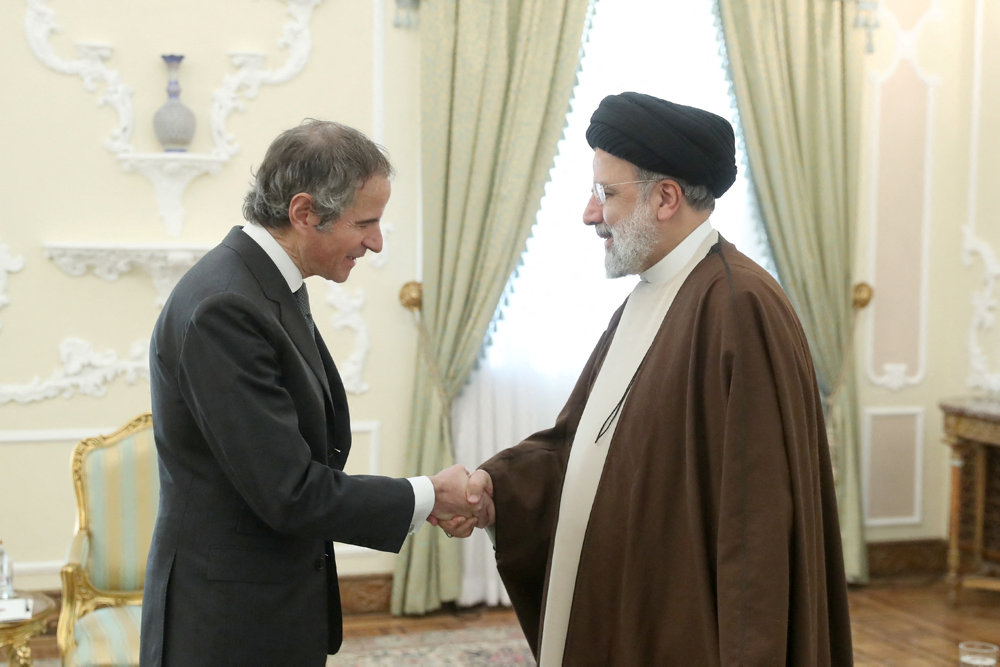 Iranian President Ebrahim Raisi meets with International Atomic Energy Agency (IAEA) Director General Rafael Grossi in Tehran