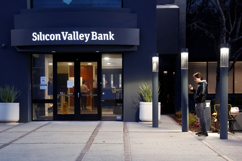 A customer lines up outside of the Silicon Valley Bank headquarters in Santa Clara