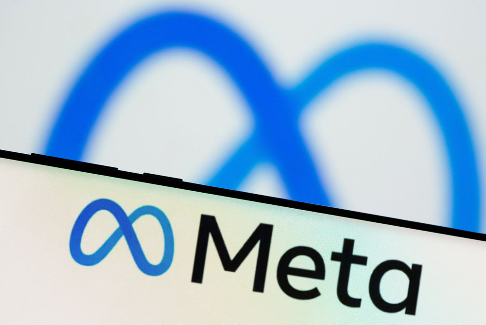 FILE PHOTO: Meta Platforms Inc''s logo is seen on a smartphone in this illustration picture