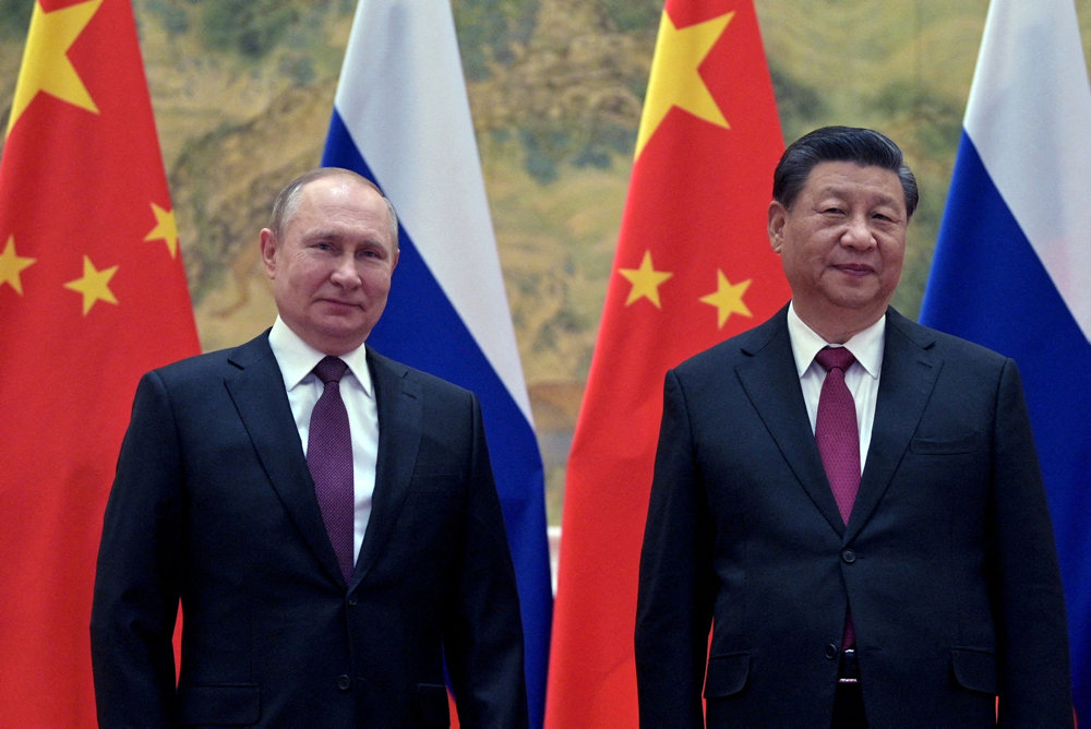 FILE PHOTO: Russian President Putin meets Chinese President Xi in Beijing