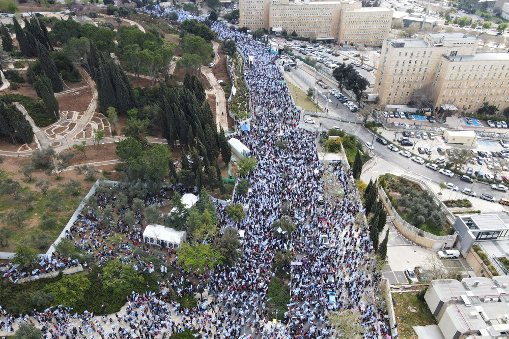 An aerial view shows protesters attending a demonstration against Israel''s judicial overhaul and dismissing of the defense minister, in Jerusalem