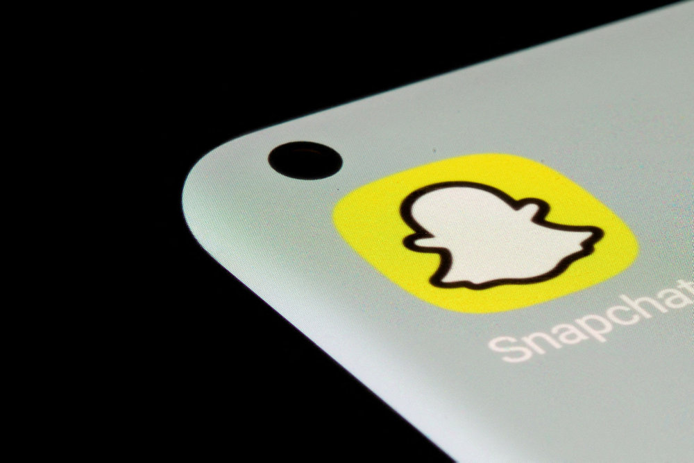 FILE PHOTO: Snapchat app is seen on a smartphone in this illustration