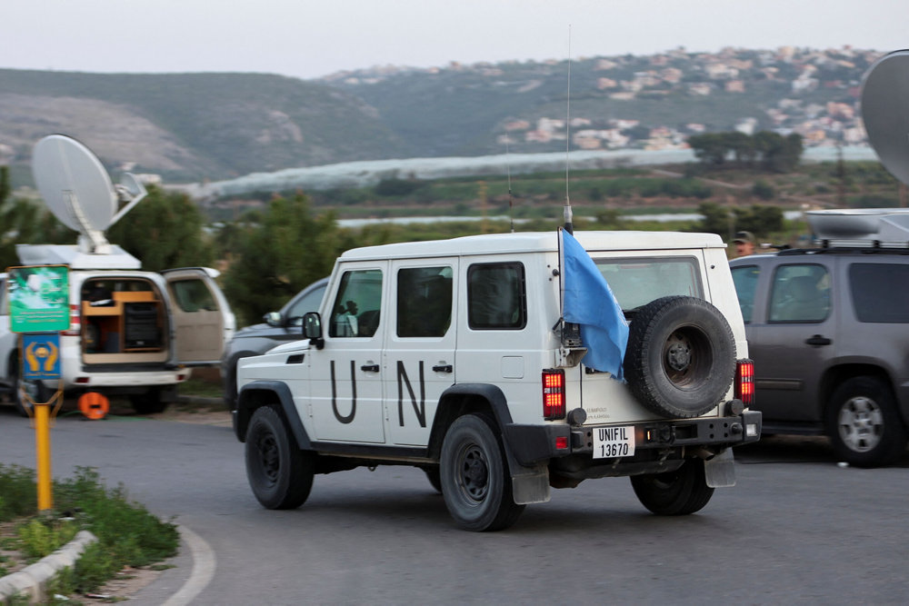 A UN peacekeeper (UNIFIL) vehicle drives in Al Qulaylah