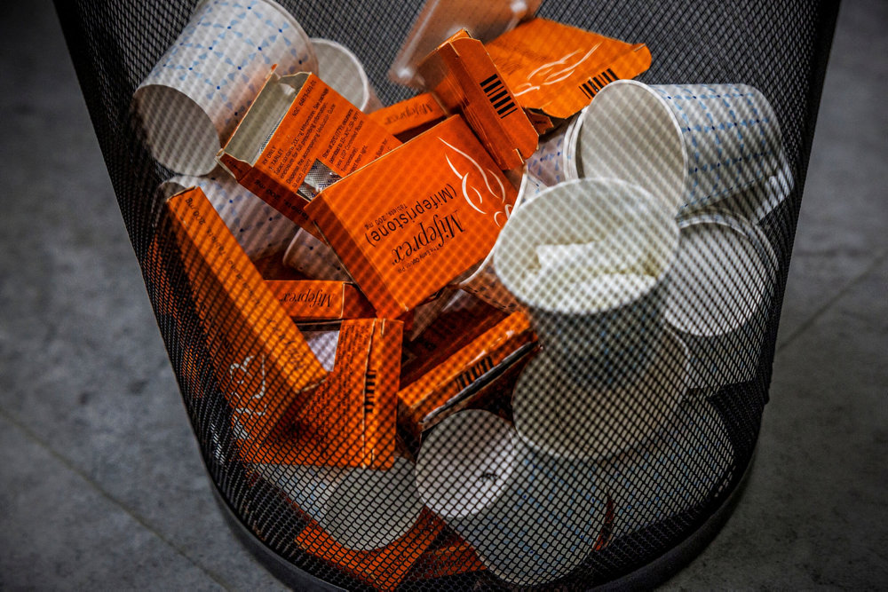 FILE PHOTO: Used boxes of Mifepristone pills, the first drug used in a medical abortion, fill a trash can at Alamo Women''s Clinic in New Mexico