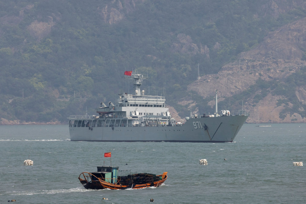 A Chinese warship sails during a military drill near Fuzhou, Fujian Province, near the Taiwan-controlled Matsu Islands