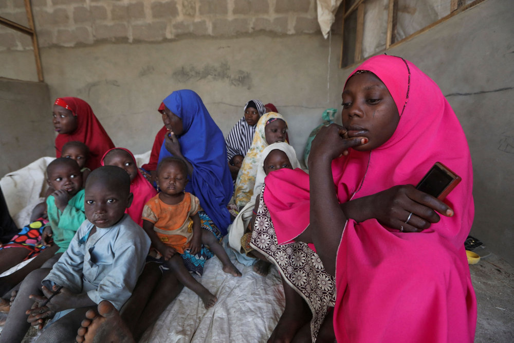 People who fled attacks by bandits in a village, are pictured in a shelter for displaced people in Gusau