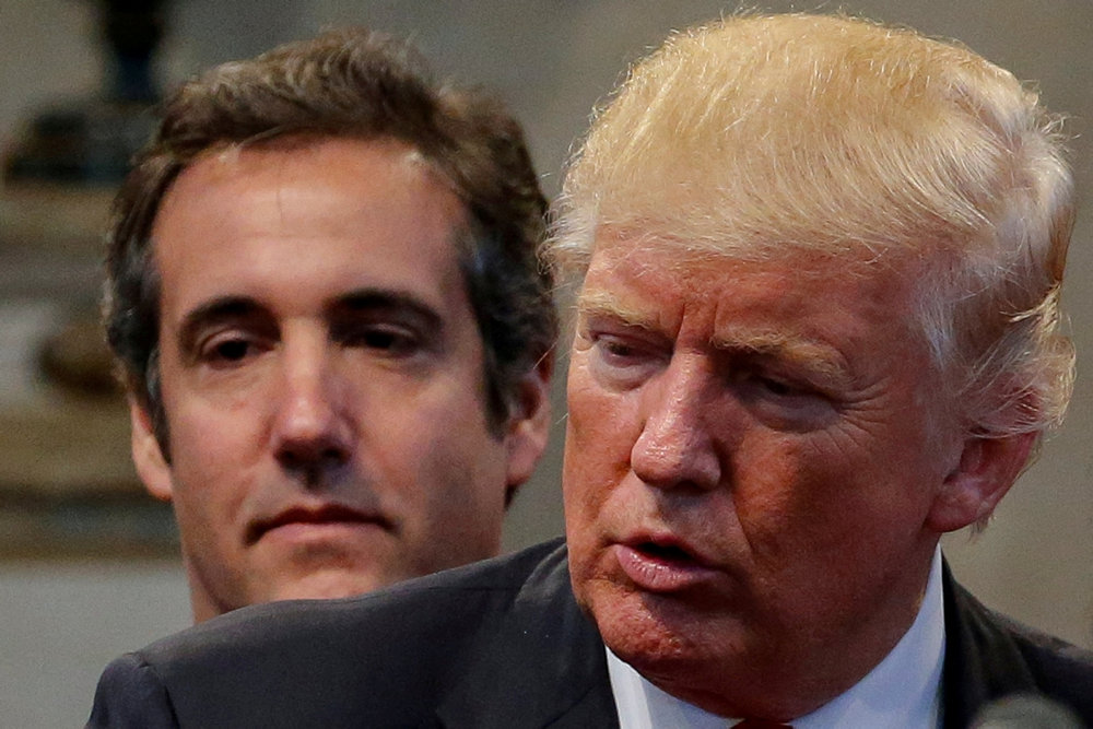 FILE PHOTO: Cohen joins supporters praying over during a campaign stop at the New Spirit Revival Center church in Cleveland Heights, Ohio