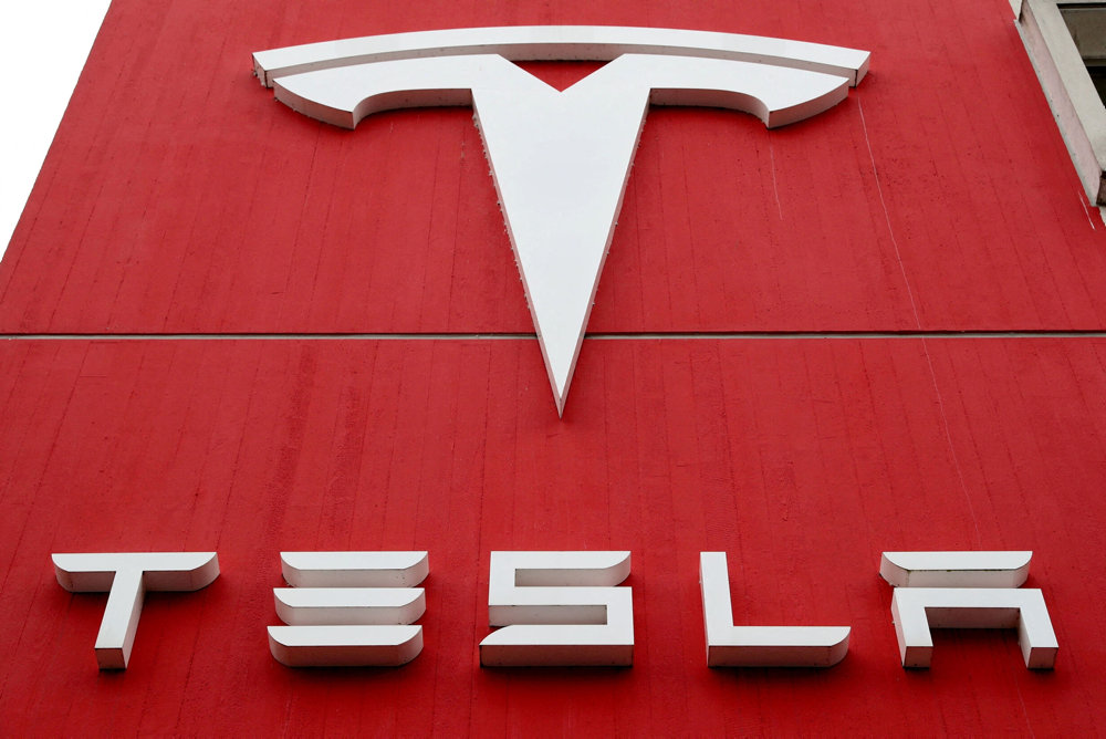 FILE PHOTO: The logo of car manufacturer Tesla is seen in Bern