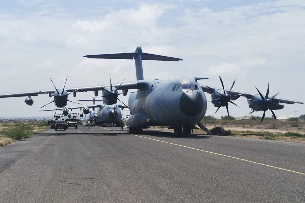 Spanish military plane and military vehicles depart on tarmac as Spanish diplomatic personnel and citizens are evacuated, in Khartoum