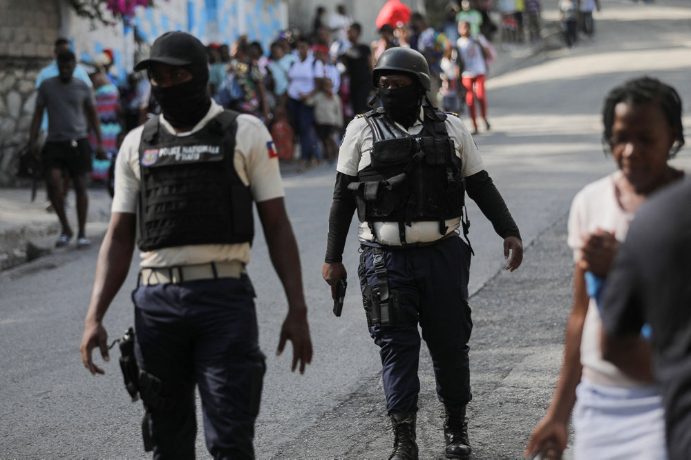 Alleged gang members set on fire by crowd of people, in Port-au-Prince