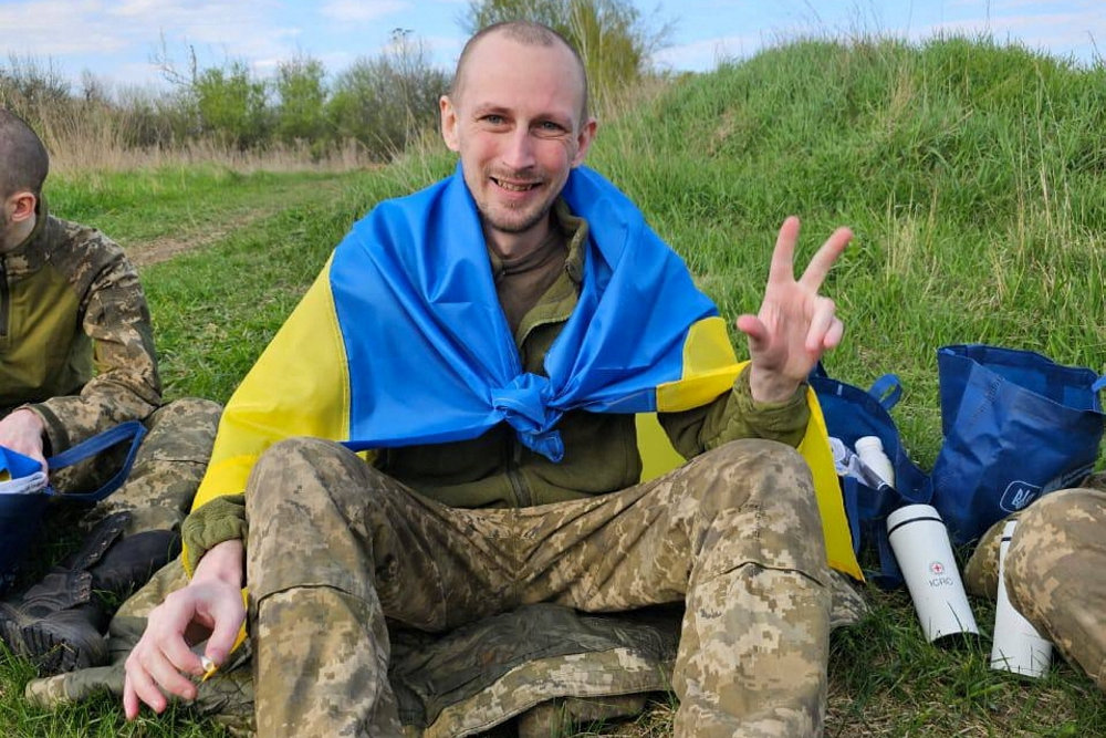 Ukrainian POW poses for a picture after a swap at an unknown location in Ukraine