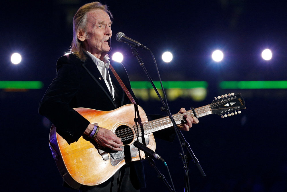 FILE PHOTO: Canadian singer songwriter Lightfoot performs during the halftime show during the 100th CFL Grey Cup championship football game in Toronto