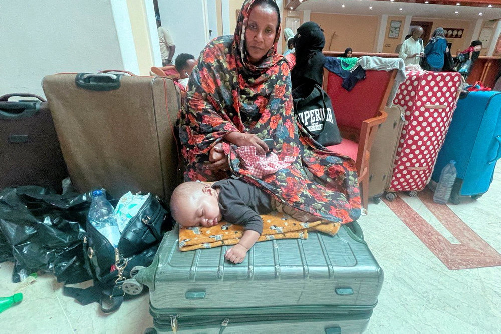 Sudanese citizens wait to be processed for evacuation, in Port Sudan