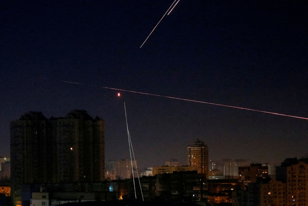 FILE PHOTO: Tracers are seen in the night sky as Ukrainian servicemen fire on the drone in Kyiv