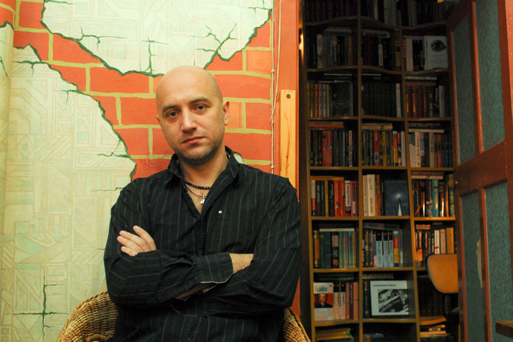 FILE PHOTO: Russian writer Zakhar Prilepin poses for a picture in his flat in Nizjnij Novgorod