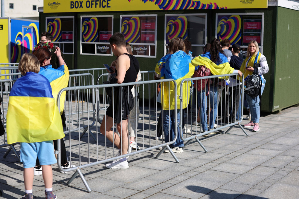 Eurovision fans arrive outside the arena ahead of the grand final of the Eurovision Song Contest in Liverpool, Britain