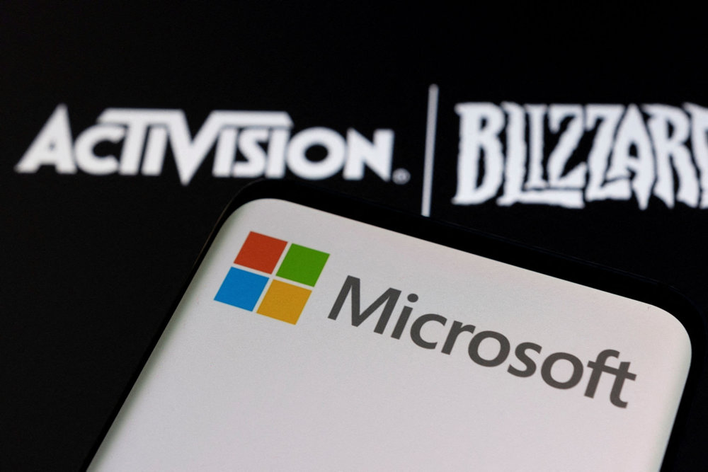 FILE PHOTO: Illustration of Microsoft and Activision Blizzard logos