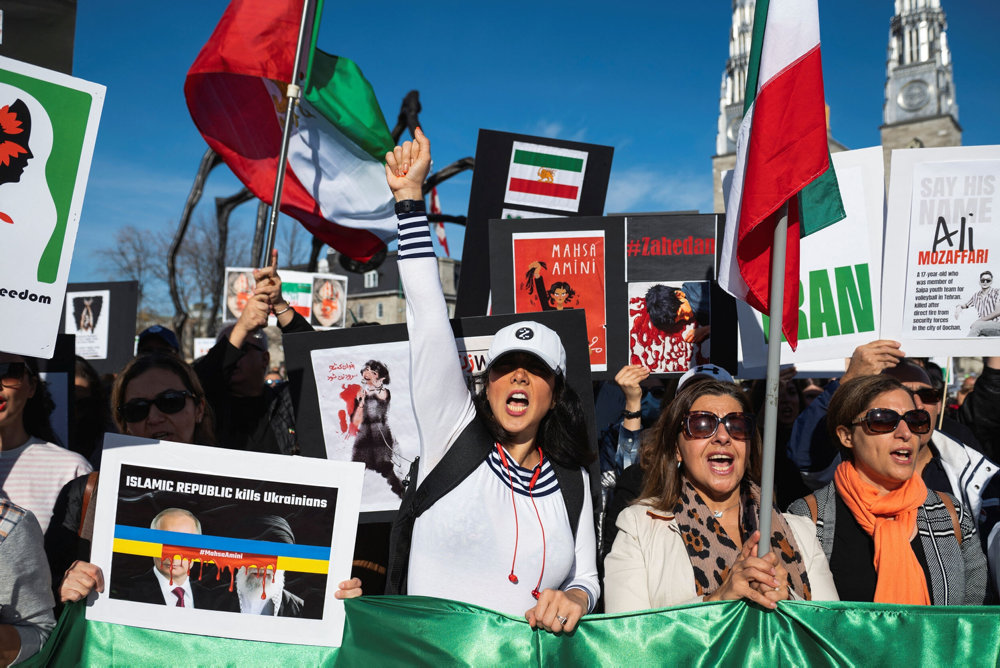 Protestors in support of women in Iran participate in a protest following the death of Mahsa Amini in Canada