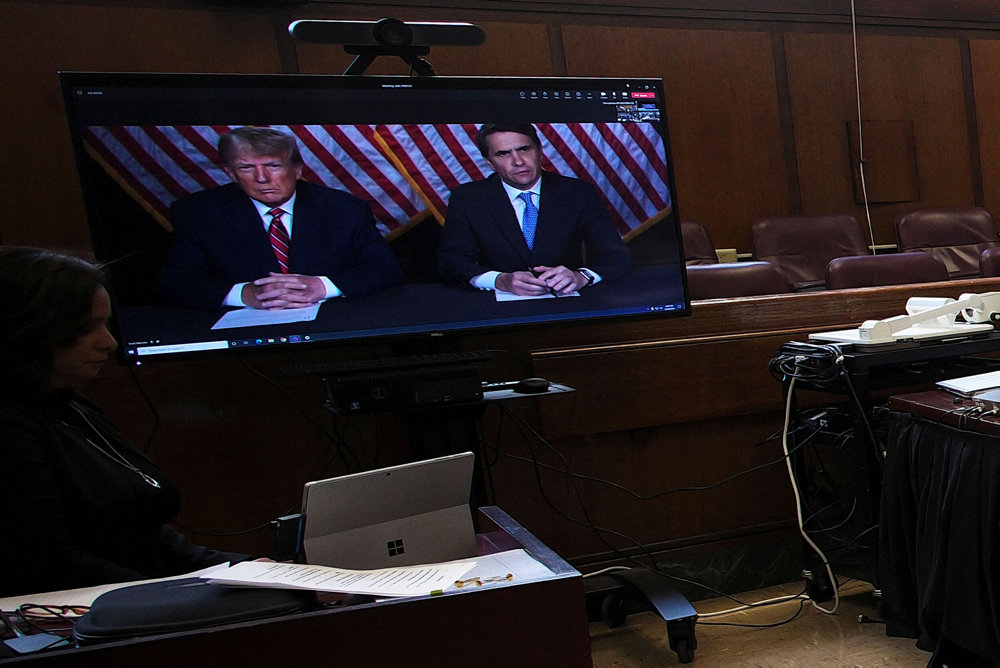 Former U.S. President Donald Trump appears by video conferencing before Justice Juan Merchan during a hearing regarding the criminal case against him over a hush money payment to porn star Stormy Daniels, in New York City