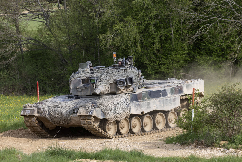 Recruits of the Swiss army Tank School 21 perform an attack exercise with the Leopard 2 tank in Bure