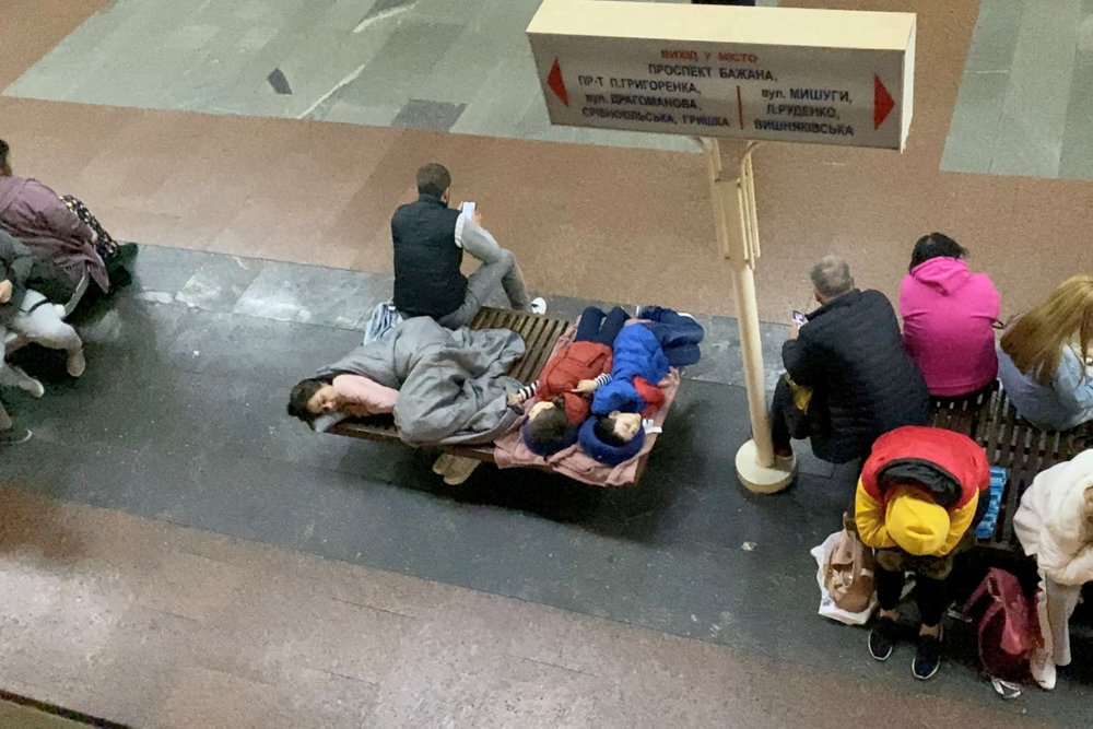 People take shelter in a subway station, in Kyiv