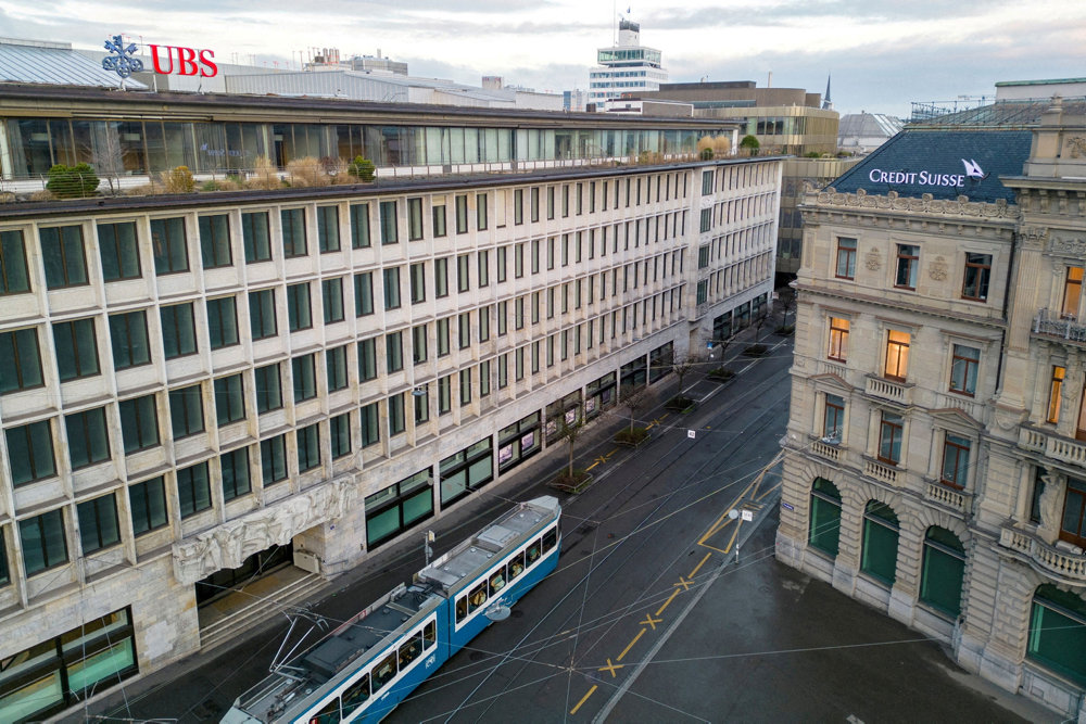 FILE PHOTO: Buildings of Swiss banks UBS and Credit Suisse are seen on the Paradeplatz in Zurich