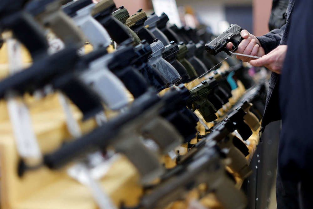 FILE PHOTO: Customers shop at the Des Moines Fairgrounds Gun Show at the Iowa State Fairgrounds in Des Moines, Iowa