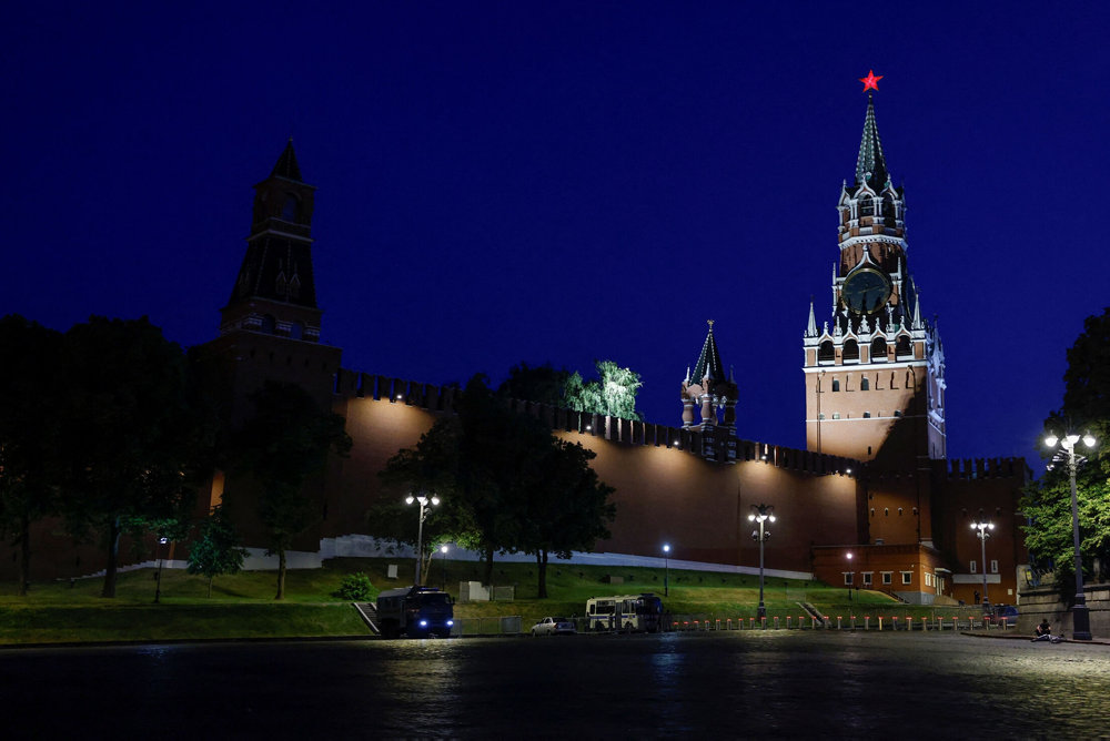 Law enforcement vehicles are seen in front of the Kremlin''s Spasskaya Tower in central Moscow