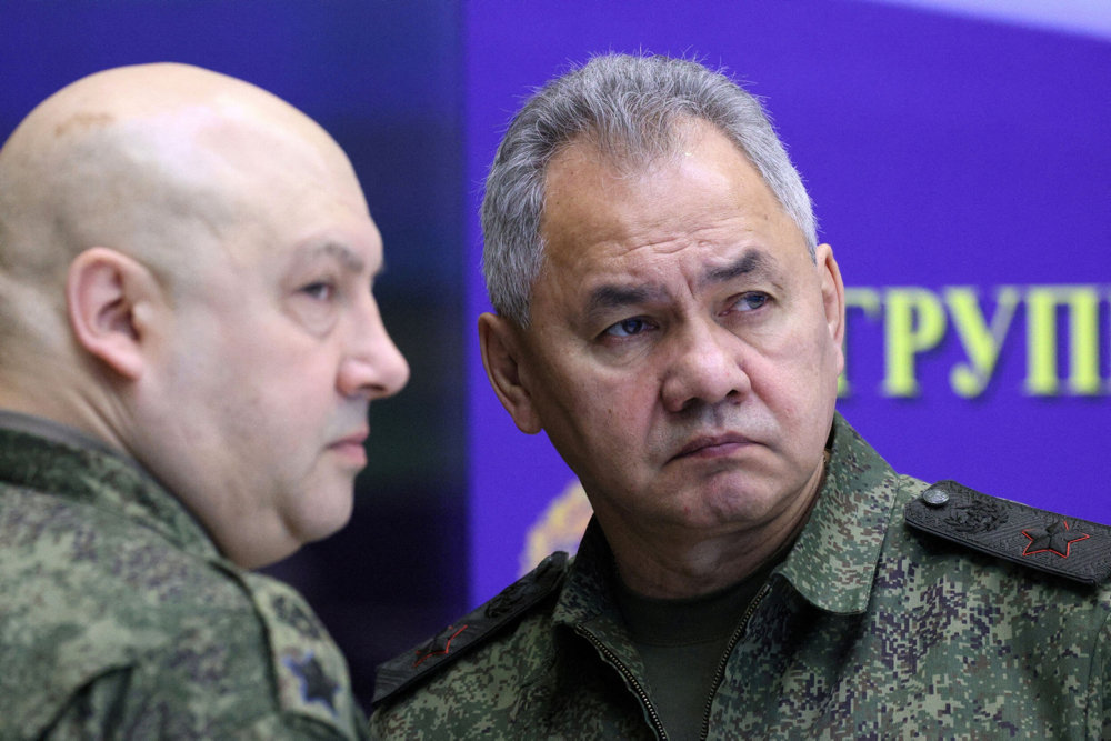 FILE PHOTO: Russian Defence Minister Sergei Shoigu and General Sergei Surovikin visit the Joint Headquarters of the Russian armed forces, in an unknown location