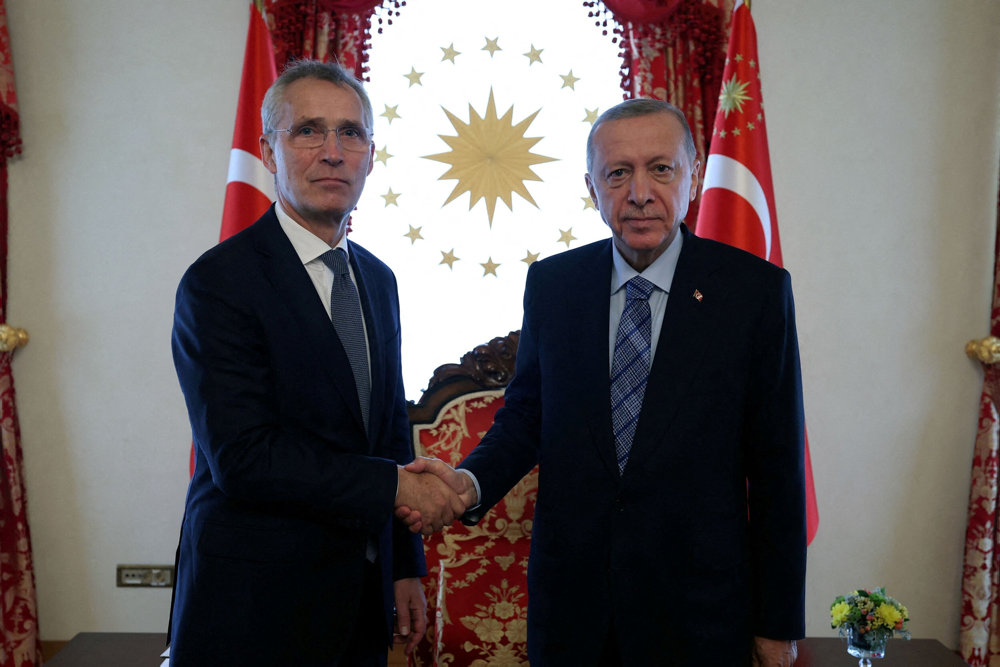 FILE PHOTO: Turkey''s President Tayyip Erdogan shakes hands with NATO Secretary General Jens Stoltenberg in Istanbul