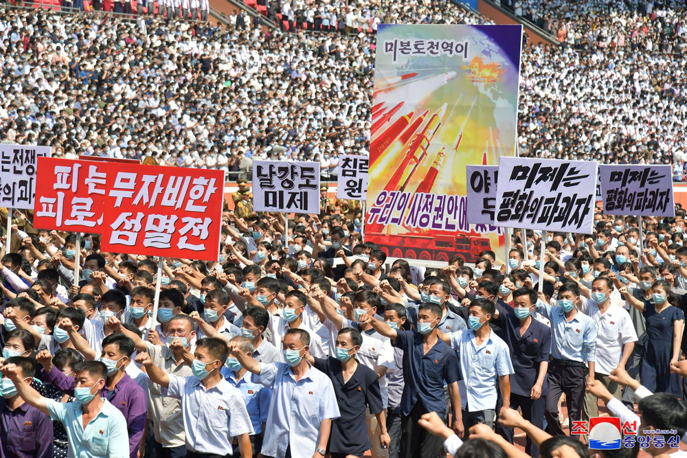 People attend a mass rally denouncing the U.S. in Pyongyang