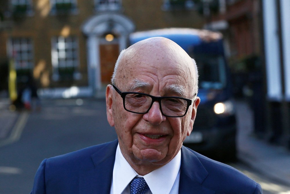 FILE PHOTO: Media mogul Rupert Murdoch leaves his home in London