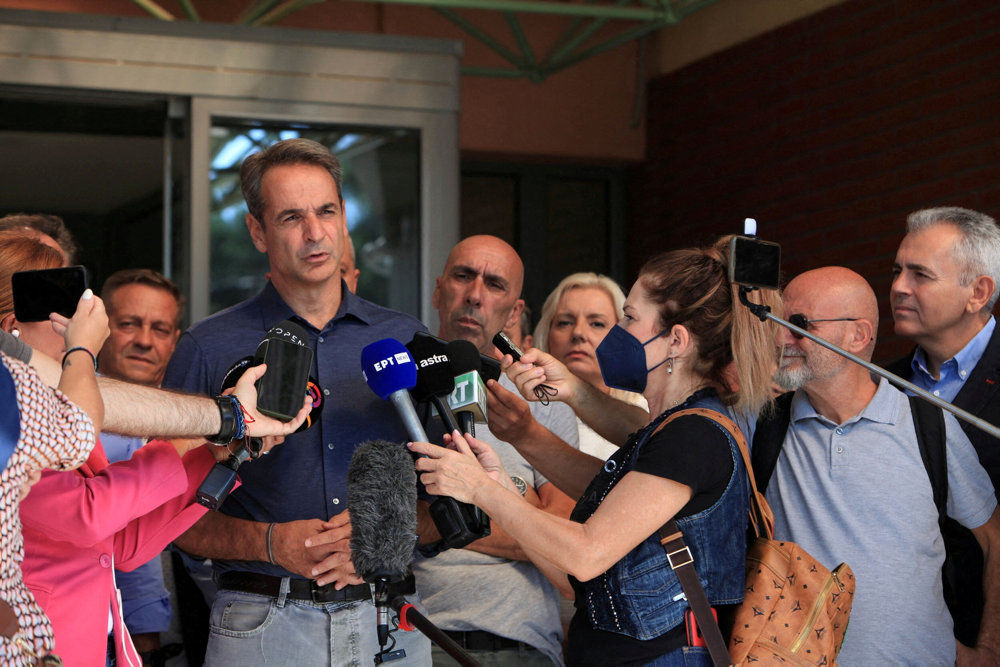 FILE PHOTO: Greek Prime Minister Kyriakos Mitsotakis speaks to journalists, in the aftermath of Storm Daniel