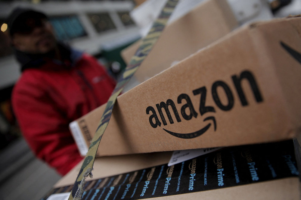 FILE PHOTO: Amazon boxes are seen stacked for delivery in the Manhattan borough of New York City