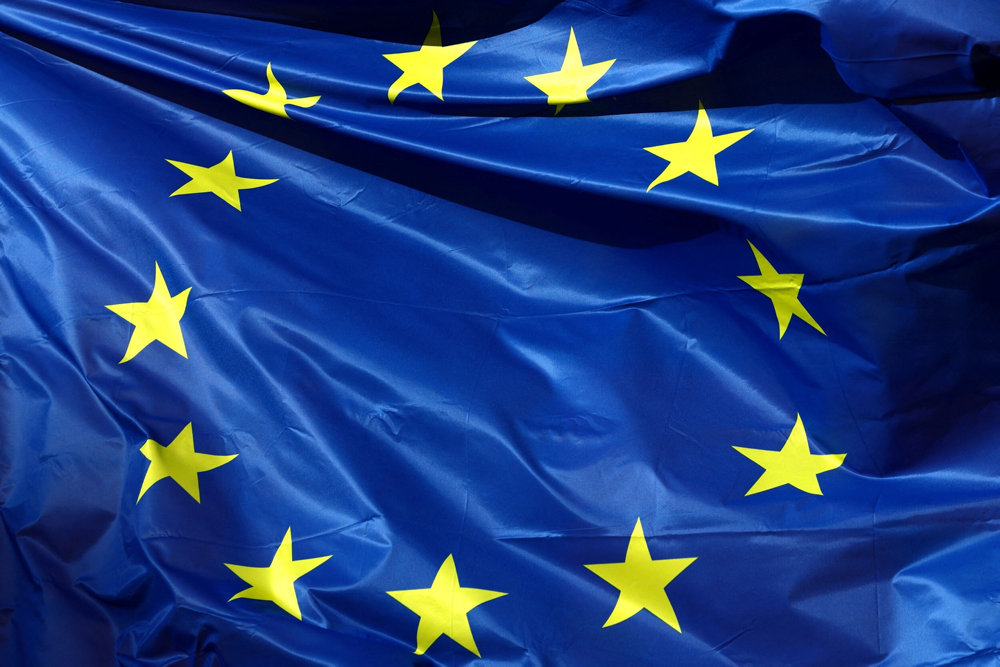 A European Union flag flutters outside the EU Commission headquarters in Brussels