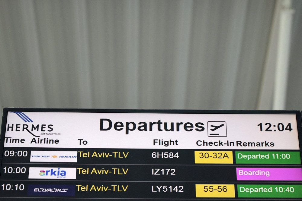 A departures board announcing flights to Tel Aviv, Israel, is seen in Larnaca International Airport, in Larnaca