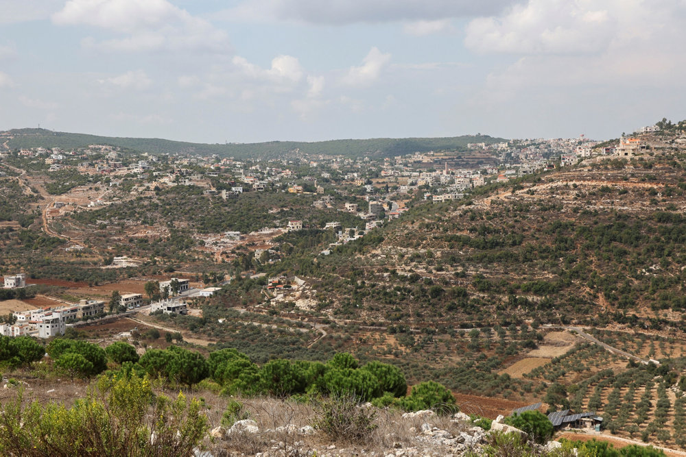 A view shows Ayta al-Shaab village as pictured from Rmeish near the Lebanese-Israeli border, in southern Lebanon