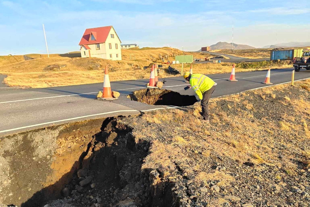 A view of cracks, emerged on a road due to volcanic activity, near Grindavik
