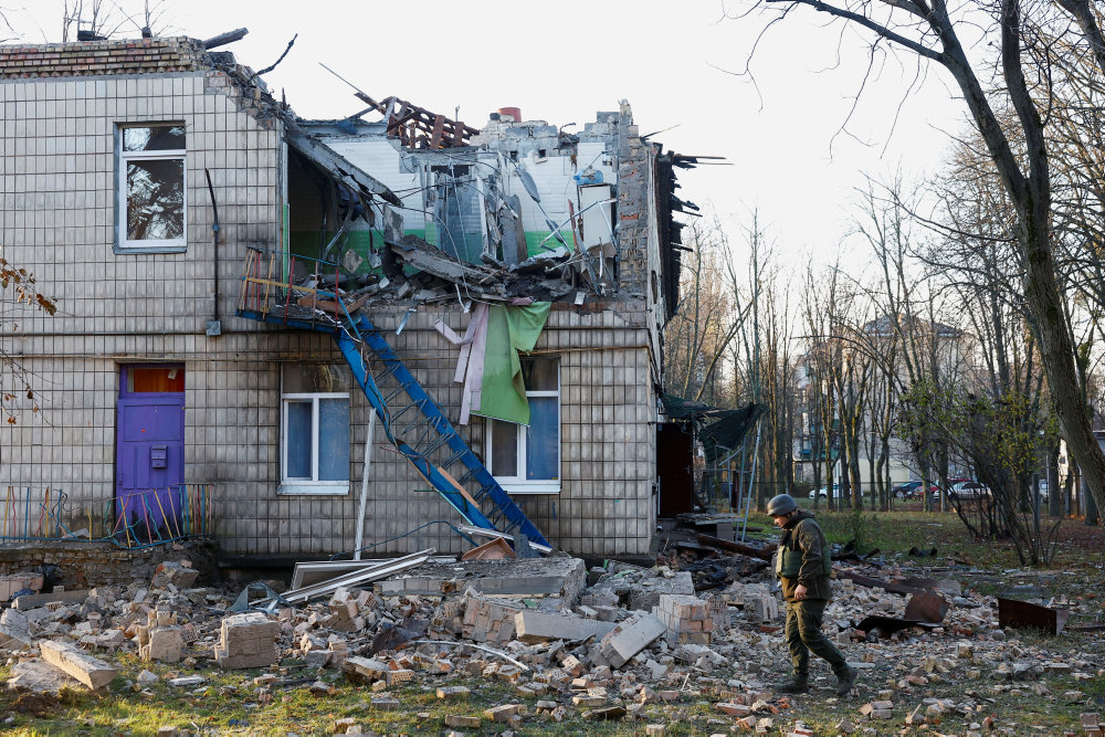 Police officers inspect the compound of a kindergarten damaged during Russian drone strikes, amid Russia''s attack on Ukraine, in Kyiv