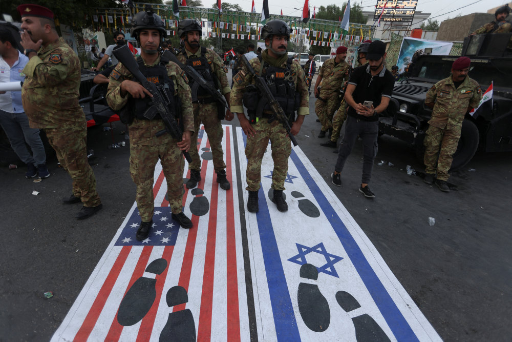 Supporters of Iraqi Shi''ite armed groups protest against U.S. support to Israel, in Baghdad