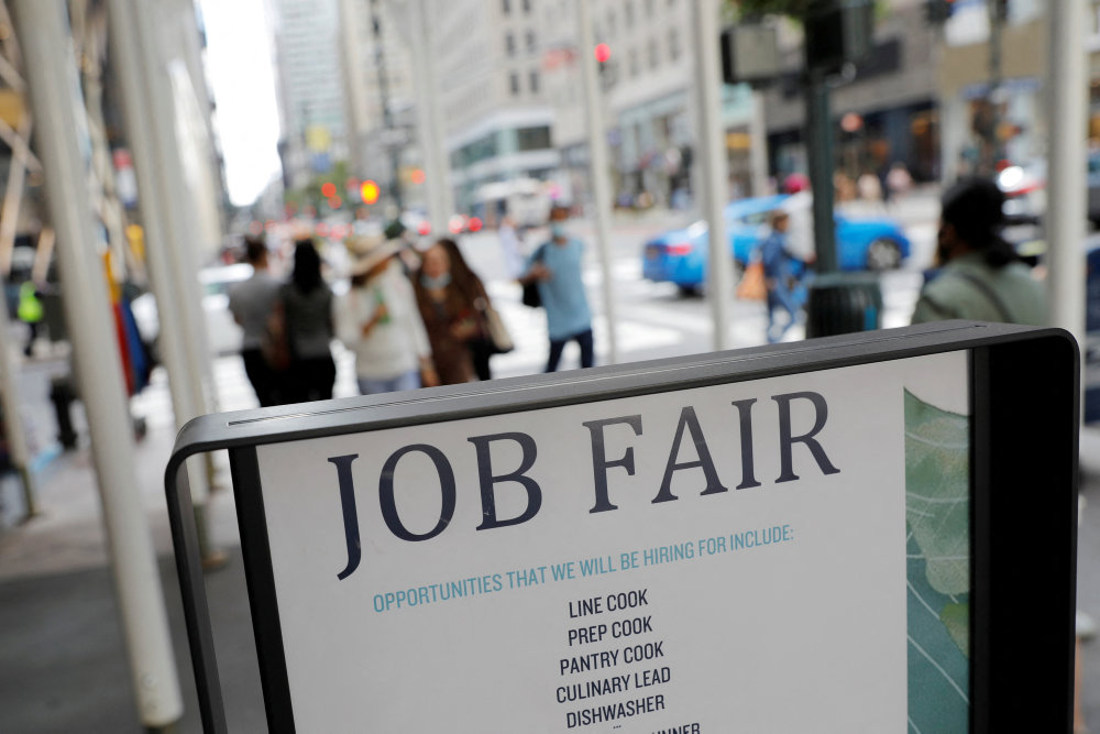 FILE PHOTO: Signage for a job fair is seen on 5th Avenue after the release of the jobs report in Manhattan, New York City
