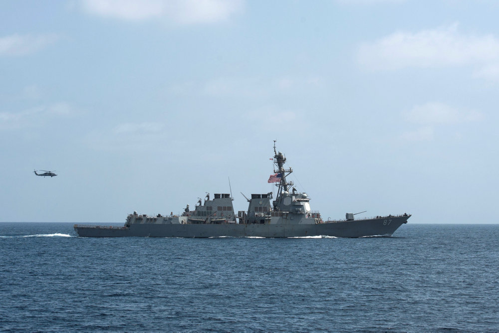 File photo of the U.S. Navy guided-missile destroyer USS Mason conducting divisional tactic maneuvers in the Gulf of Oman