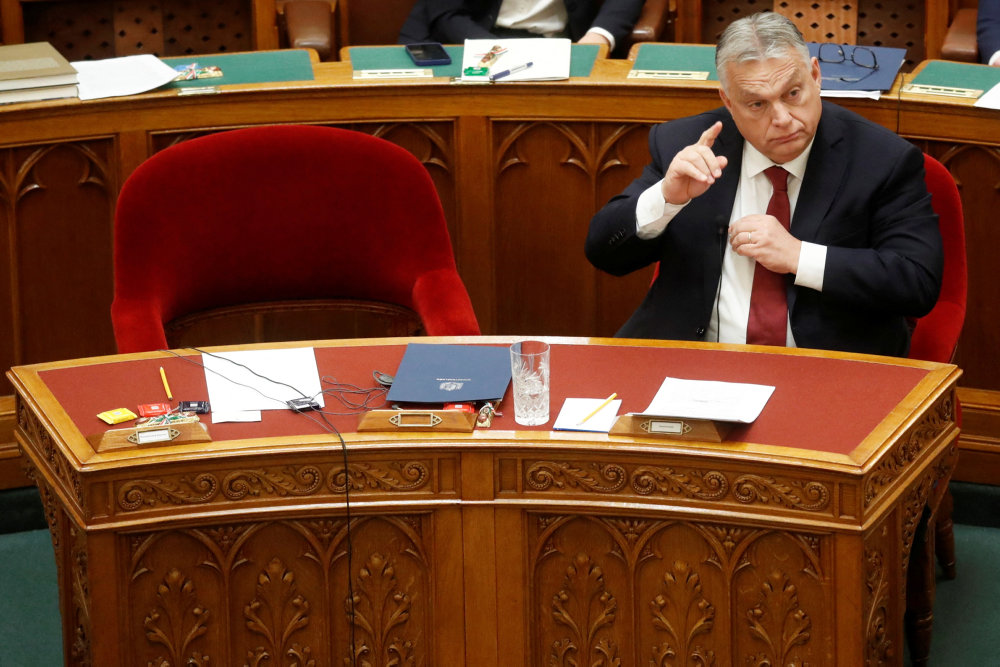 Hungarian Prime Minister Orban gestures before he addresses the Parliament in Budapest